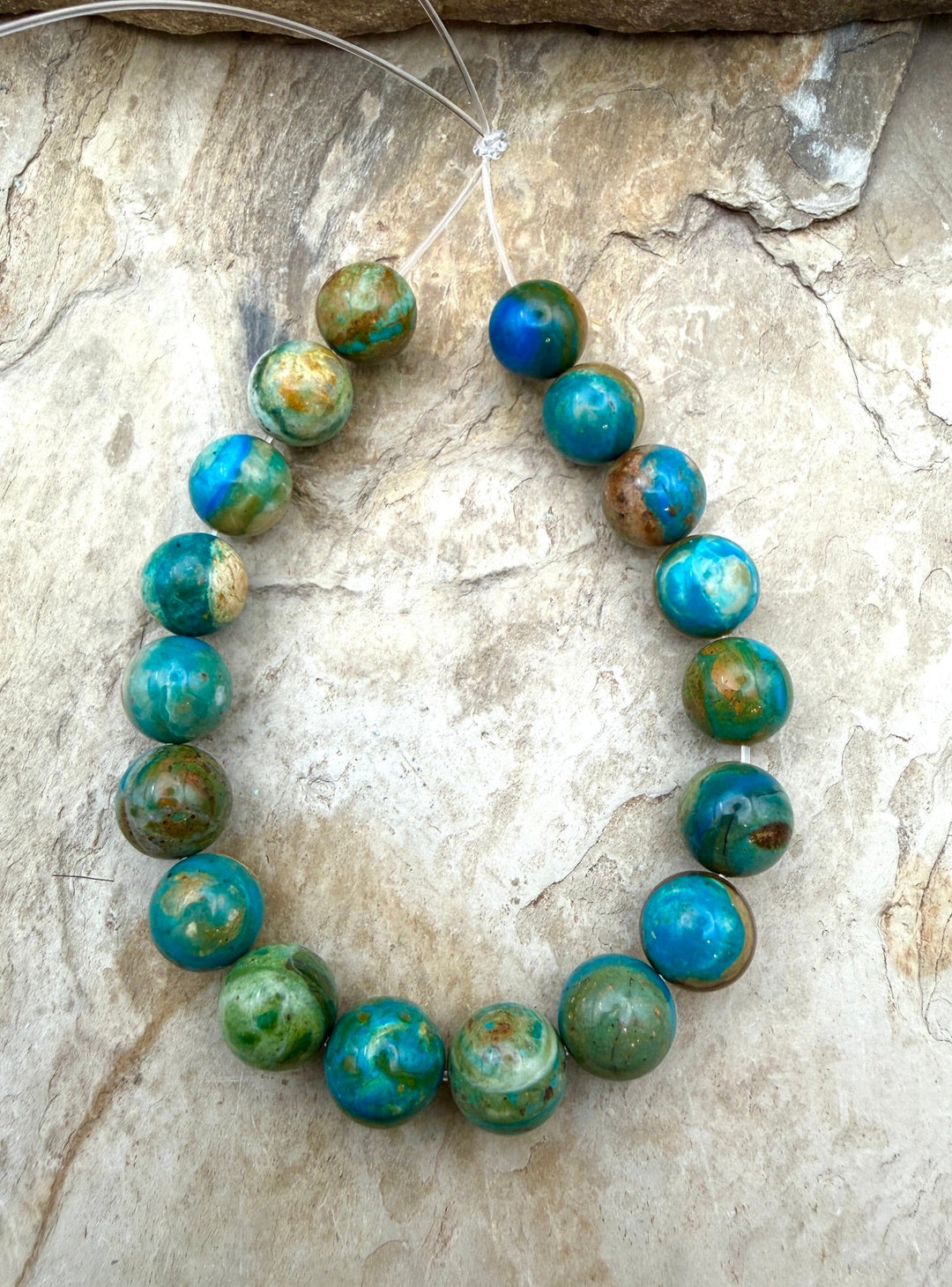 AAA+ Peruvian Blue Opal 11.5-12mm Round Beads 8 Inch