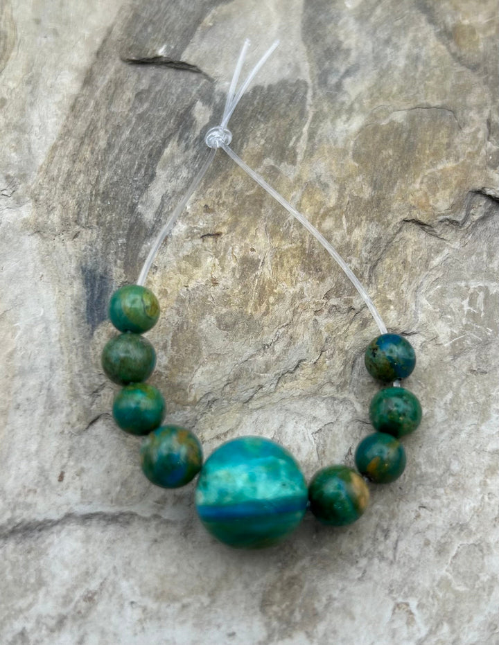 AAA+ Peruvian Blue Opal 7-13.5mm Round Beads Focal Strand/9