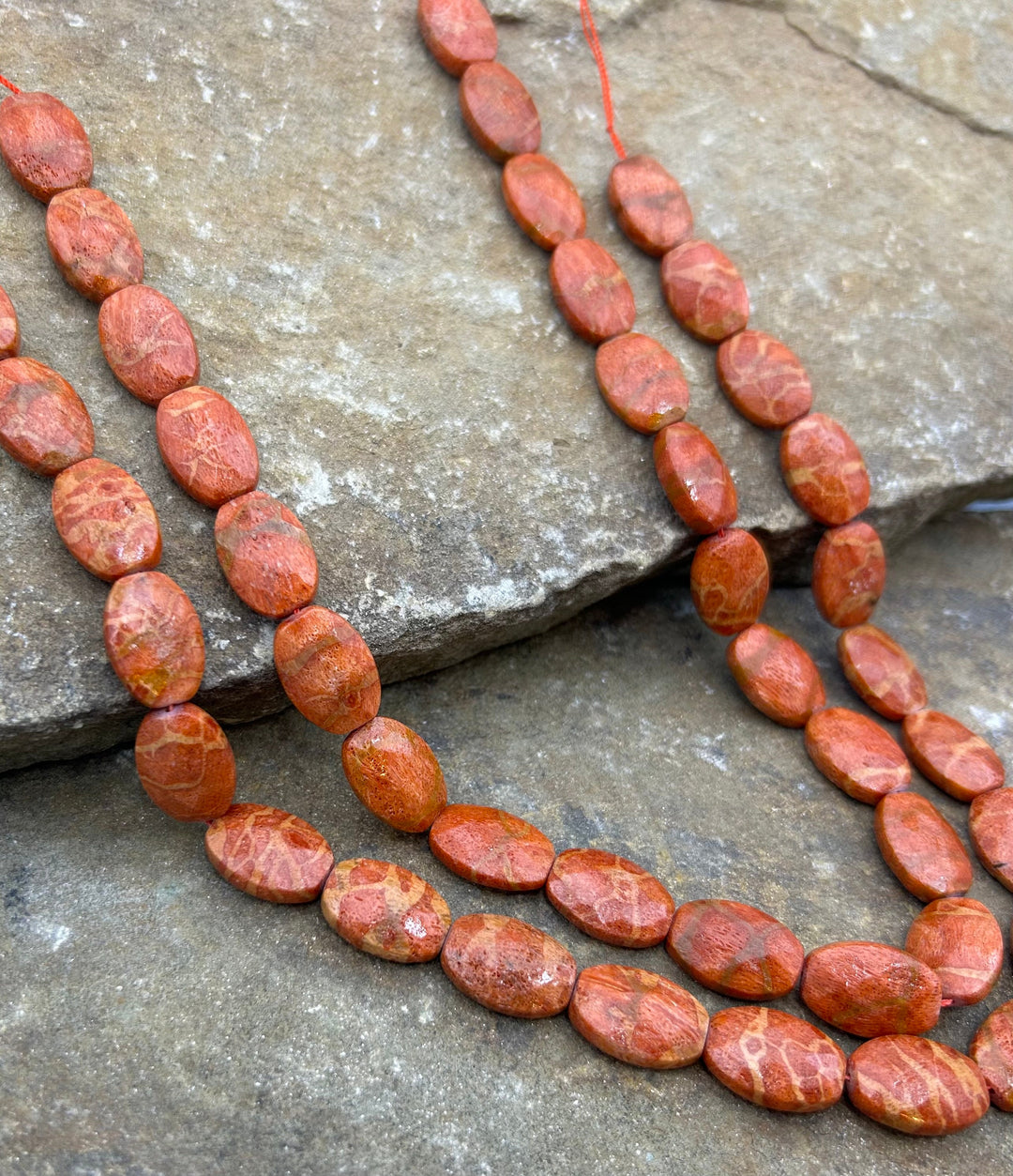 Apple Coral Faceted Oval Beads 12x20mm 16 inch strand
