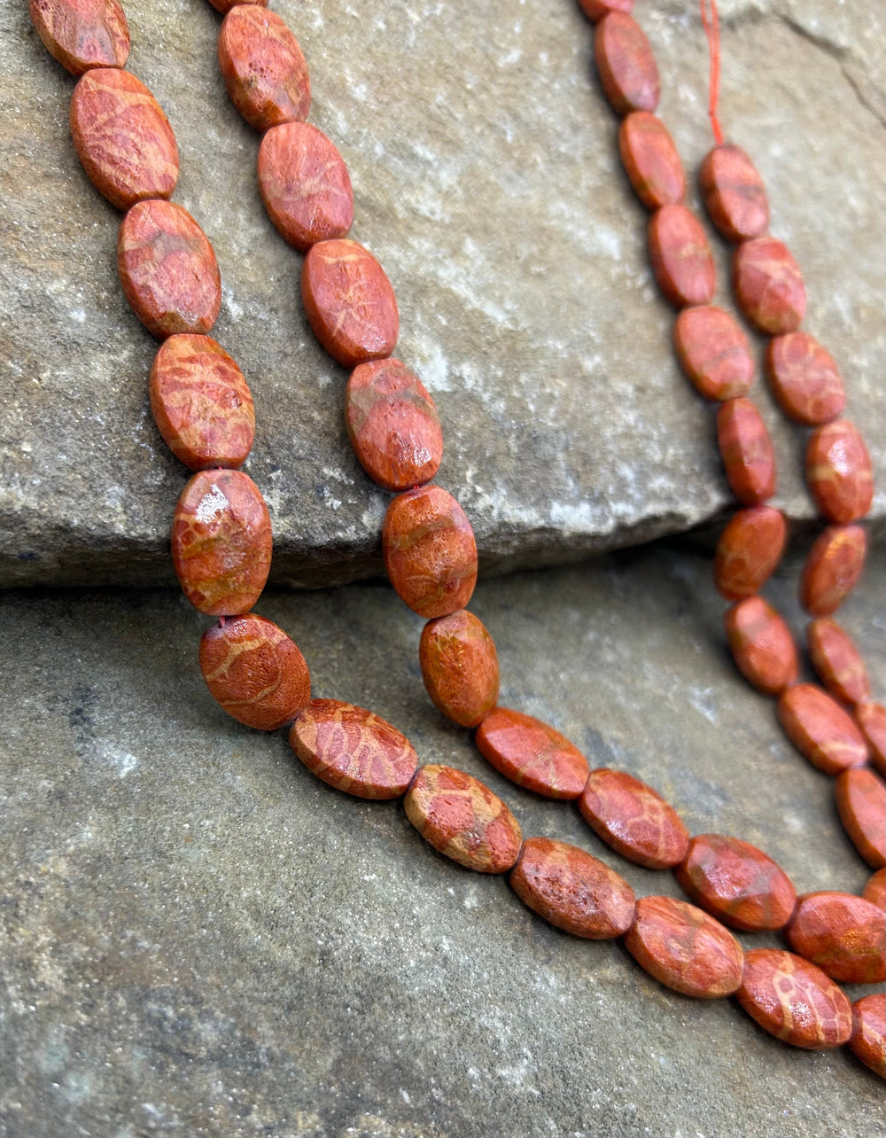 Apple Coral Faceted Oval Beads 12x20mm 16 inch strand