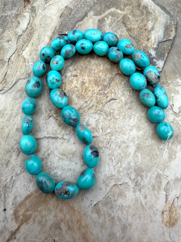 Campitos Turquoise (Mexico) with Pyrite Smooth Oval Nugget