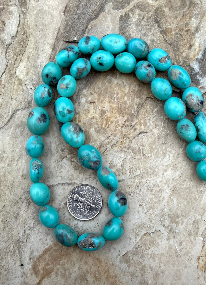 Campitos Turquoise (Mexico) with Pyrite Smooth Oval Nugget